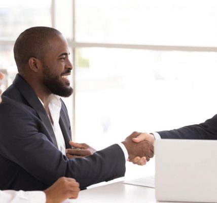 Man shaking hand with insurance agent